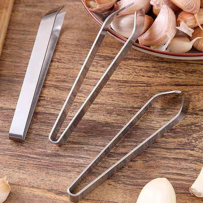 🎉[Kreativ present]🎁Högkvalitativa 304 rostfria stålklämmor för att skala vitlök i köket💥Köp 2 få 3 gratis tidsbegränsat erbjudande